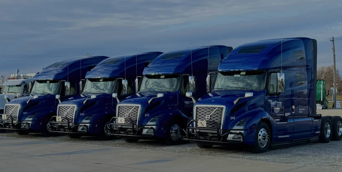 Wolf river express trucks lined up next to each other